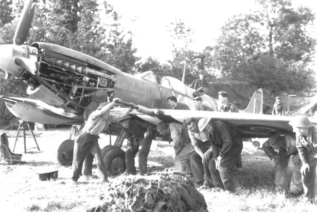 127 Wing (403 Squadron) erks at work B2 Crepon France June 1944